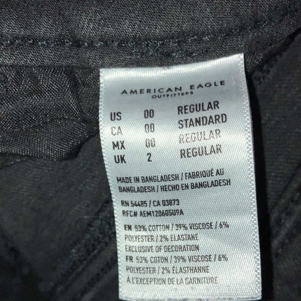 American Eagle*. Black, distressed, ‘NE(x)T Level Stretch’ Denim